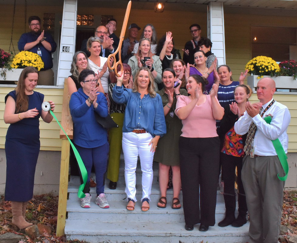 Suzette Merrick of Reflection House Cuts Ribbon